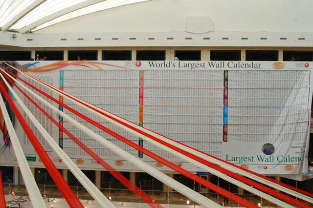 The hand-painted wall calendar rigged across its full 120 foot span